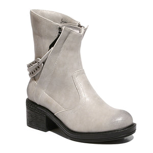 White Three quarter view mid-heel bootie with zipper closure and sole material rubber