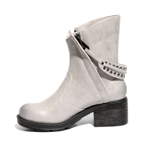 White inside side view mid-heel bootie with zipper closure and sole material rubber